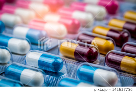 Selective focus of colorful prescription capsule medication in blister packs, pharmaceutical healthcare concept for pharmacy, hospital treatment, medicine packaging and pharmaceutical industry. 141637756