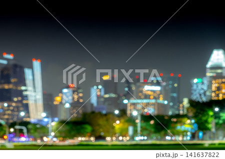 Abstract blurred modern city skyline with colorful bokeh lights at night, urban background with copy space for business, technology, innovation, smart city and corporate design. Abstract blurred modern city skyline with colorful bokeh lights at night, urban background with copy space for business, technology, innovation, smart city and corporate design. 141637822