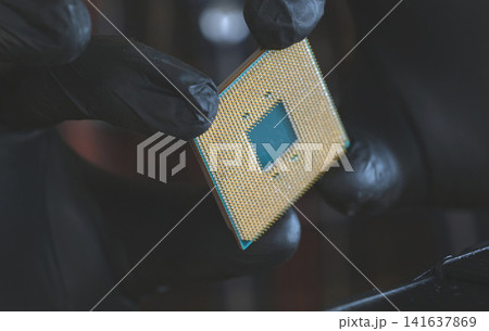 Computer Repairman Examining Pc Processor Computer Repairman Examining Pc Processor 141637869