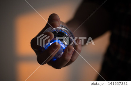 Man Rotating A Gyroball Trainer Man Rotating A Gyroball Trainer 141637881