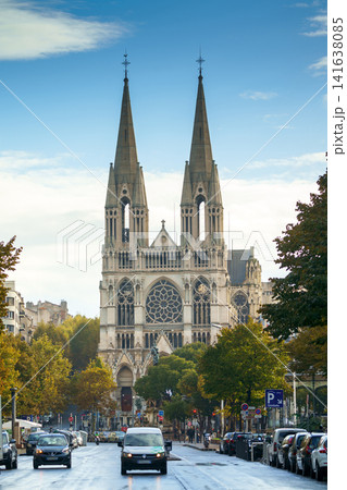 Marseille, France - Nov 3 2018, vertical view of Gothic cathedral of St. Vincent de Paul Church in foreground, cars are driving on road, at daytime with a cloudy sky, without people, Marseille, France 141638085