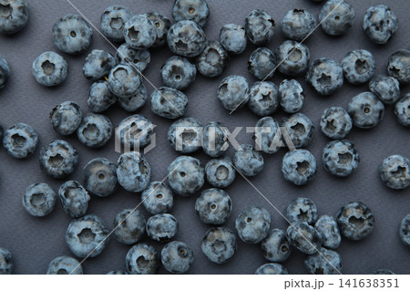 Blueberry on dark blue background. Top view 141638351