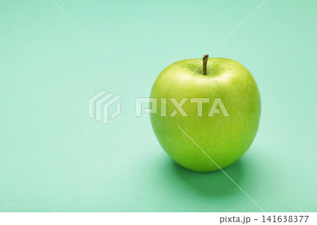 Green apple on mint background. Space for text 141638377