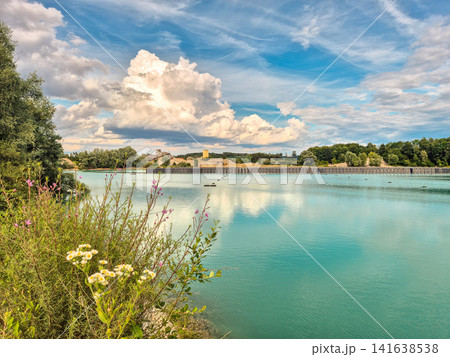 Vertical floating solar power plant on turquoise quarry lake in Gilching, Bavaria: Innovative floating photovoltaic panels on lake, renewable energy concept, sustainable electricity generation 141638538