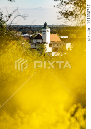 Vibrant Yellow Rapeseed Field With Gilching Village Church In Background - Bavarian Countryside Spring Landscape, Blooming Canola, Rural Bavaria Germany, Soft Bokeh 141638747