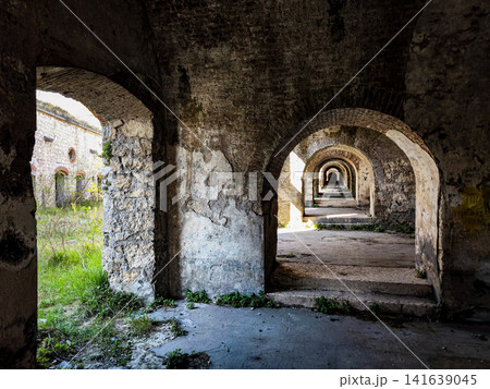 Stone Archway Corridor Inside Forte San Marco: Historic Fortress Interior With Repeating Arches And Natural Light Stone Archway Corridor Inside Forte San Marco: Historic Fortress Interior With Repeating Arches And Natural Light 141639045