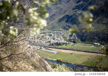 Adige River Valley And Dolci Village Viewed From Placca Del Forte San Marco: Panoramic Spring Landscape Near Lake Garda Adige River Valley And Dolci Village Viewed From Placca Del Forte San Marco: Panoramic Spring Landscape Near Lake Garda 141639048