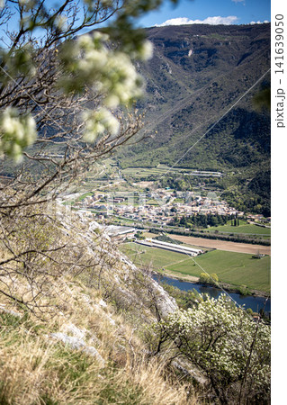 Adige River Valley And Dolci Village Viewed From Placca Del Forte San Marco: Panoramic Spring Landscape Near Lake Garda Adige River Valley And Dolci Village Viewed From Placca Del Forte San Marco: Panoramic Spring Landscape Near Lake Garda 141639050
