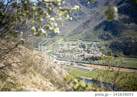 Adige River Valley And Dolci Village Viewed From Placca Del Forte San Marco: Panoramic Spring Landscape Near Lake Garda Adige River Valley And Dolci Village Viewed From Placca Del Forte San Marco: Panoramic Spring Landscape Near Lake Garda 141639055