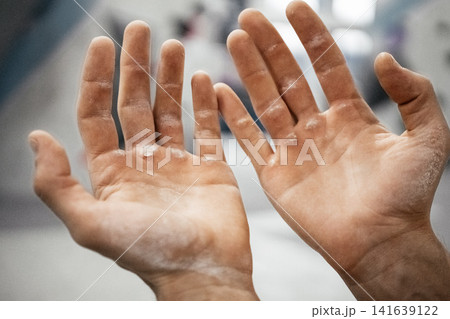 Chalk Covered Male Climber Hands After Hard Route: Close Up Of Worn Fingers And Taped Skin 141639122
