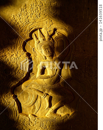Black and white Stone Relief Of Apsara Dancer In Siem Reap Cambodia: Ancient Khmer Temple Carving Illuminated By Dramatic Side Light Black and white Stone Relief Of Apsara Dancer In Siem Reap Cambodia: Ancient Khmer Temple Carving Illuminated By Dramatic Side Light 141639518