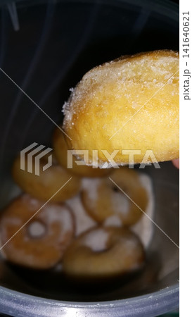 Selective focus shot of delicious and indulgent sweet sugar donut. Donut, Donut or Doughnut, popular cake made from flour and potatoes with icing sugar on top. Selective focus shot of delicious and indulgent sweet sugar donut. Donut, Donut or Doughnut, popular cake made from flour and potatoes with icing sugar on top. 141640621