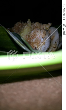 Low angle shot of traditional snacks in Indonesia. a popular snack with brown sugar sauce and grated coconut. 141640755