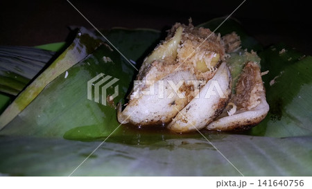 Low angle shot of traditional snacks in Indonesia. a popular snack with brown sugar sauce and grated coconut. Low angle shot of traditional snacks in Indonesia. a popular snack with brown sugar sauce and grated coconut. 141640756