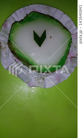 Green and white Lapindo Mud Cake (talam) sprinkled with green pandan leaves looks beautiful and charming. 141640841