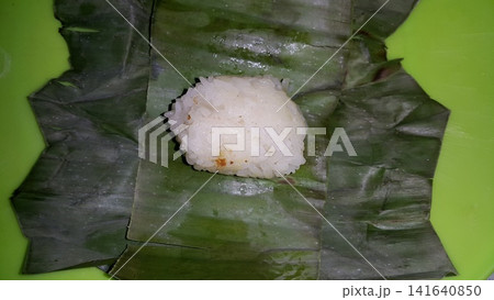 Indonesian Tradisional food called lemper contain rice cake with chicken inside. Indonesian Tradisional food called lemper contain rice cake with chicken inside. 141640850