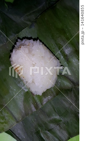 Indonesian Tradisional food called lemper contain rice cake with chicken inside. Indonesian Tradisional food called lemper contain rice cake with chicken inside. 141640855