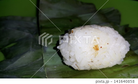 Indonesian Tradisional food called lemper contain rice cake with chicken inside. Indonesian Tradisional food called lemper contain rice cake with chicken inside. 141640858