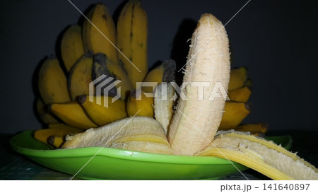 Shot of peeled banana with vanilla white color. Shot of peeled banana with vanilla white color. 141640897