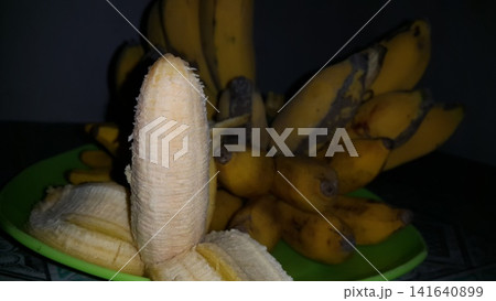 Shot of peeled banana with vanilla white color. Shot of peeled banana with vanilla white color. 141640899