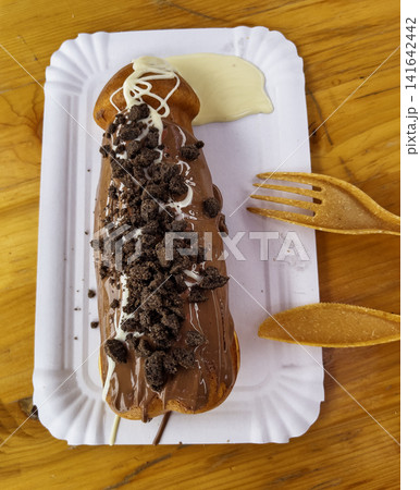 Chocolate-Covered Sweet Pastry with Cookie Crumbs Chocolate-Covered Sweet Pastry with Cookie Crumbs 141642442