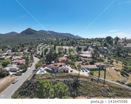 Aerial view of Ramona neighborhood with mountain, valley and golf course Aerial view of Ramona neighborhood with mountain, valley and golf course 141645086