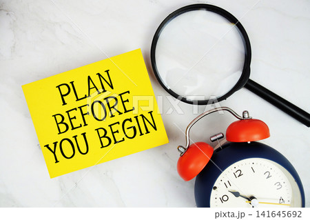 Plan Before You Begin text with sticky note and alarm clock flat lay on marble background 141645692