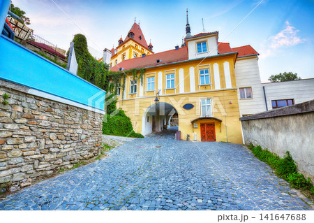 Remarkable evening view of historic town Sighisoara and Clock Tower built by Saxons. Remarkable evening view of historic town Sighisoara and Clock Tower built by Saxons. 141647688