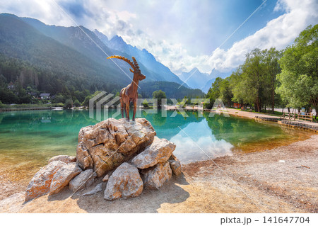 Gorgeous landscape on Jasna lake with beautiful reflections of the mountains. 141647704