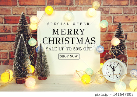 Merry Christmas Sale 50% off Display with LED Lights Cotton Balls and Mini Trees Promotion Offer Discount Retail Shopping Concept Merry Christmas Sale 50% off Display with LED Lights Cotton Balls and Mini Trees Promotion Offer Discount Retail Shopping Concept 141647805