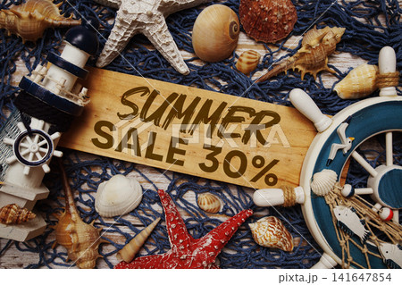 Summer Sale 30% off text on wooden sign decorated with marine nautical on a wooden background 141647854
