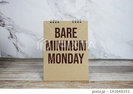 Bare Minimum Monday text wirtten on calendar mockup Bare Minimum Monday text wirtten on calendar mockup 141648355
