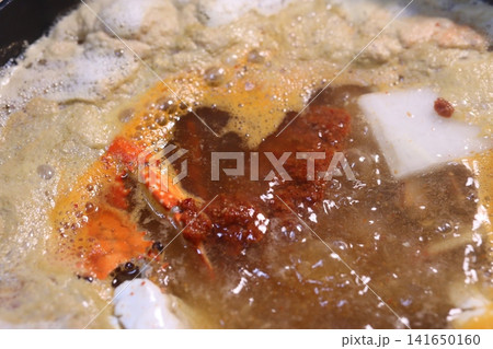 Boiling Pot of Spicy Crab and Tofu Soup 141650160