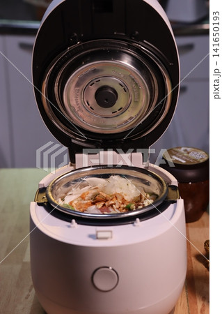 Open Kitchen Appliance with Meal Inside 141650193