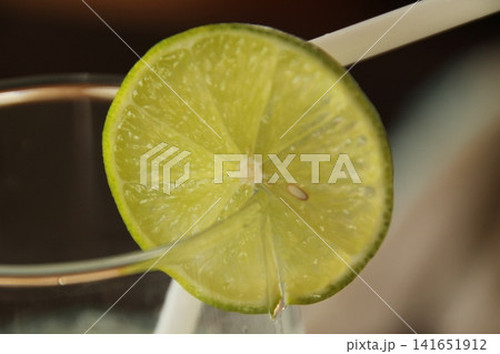 Lemon slice in a glass Lemon slice in a glass 141651912