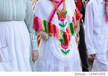 Mexican folk dancers marching in the street Mexican folk dancers marching in the street 141651976