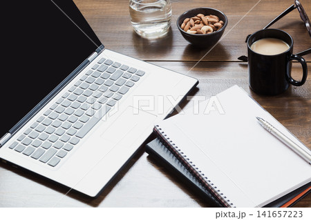 Workplace with open laptop, accessory on office table. Top view and copy space. Workplace with open laptop, accessory on office table. Top view and copy space. 141657223