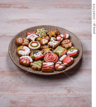 Gingerbread as a Christmas staple, sweet biscuits for the holiday. Gingerbread as a background Gingerbread as a Christmas staple, sweet biscuits for the holiday. Gingerbread as a background 141657374