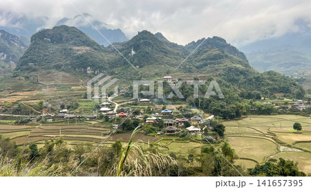 Beautiful Landscape Of Vietnamese Ethnic Minority Village And Magnificent Limestone Mountains In Ha Giang Province, Vietnam. Beautiful Landscape Of Vietnamese Ethnic Minority Village And Magnificent Limestone Mountains In Ha Giang Province, Vietnam. 141657395