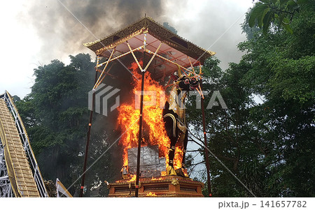 The cremation ceremony for the burning of a bull sculpture in the small town of Ubud on the island of Bali. The cremation ceremony for the burning of a bull sculpture in the small town of Ubud on the island of Bali. 141657782