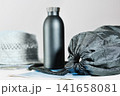 Black rucksack , bottle and maps 141658081