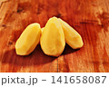 Uncooked peeled potatoes 141658087