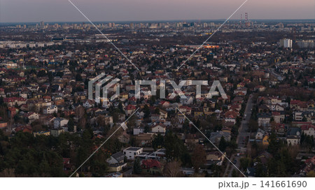 Aerial dusk view of Warsaw suburbia toward skyline and radio masts 141661690