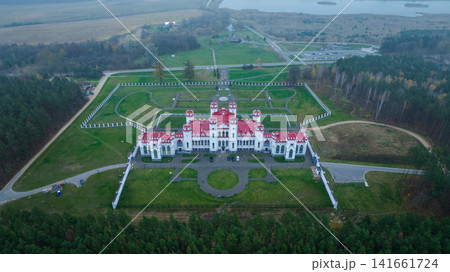Aerial neo Gothic palace in Belarus with walled garden and lake Aerial neo Gothic palace in Belarus with walled garden and lake 141661724