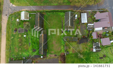 Vertical aerial view of Belarusian dacha village plots in autumn Vertical aerial view of Belarusian dacha village plots in autumn 141661731