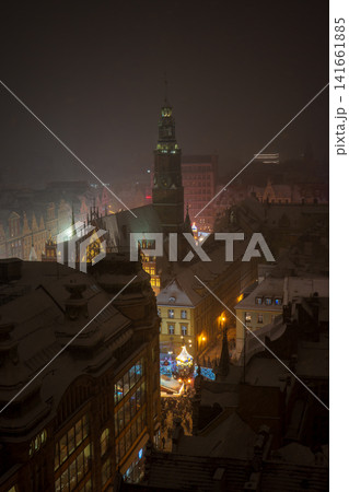 Snowy night in Wroclaw Old Town with Old Town Hall tower aglow 141661885