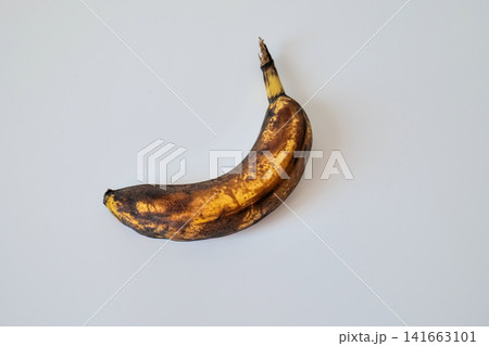 Single Overripe Banana on White Background Single Overripe Banana on White Background 141663101