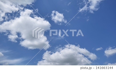 Blue Sky With White Fluffy Clouds Blue Sky With White Fluffy Clouds 141663144
