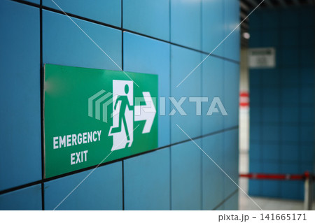 Emergency exit sign in a subway station Emergency exit sign in a subway station 141665171
