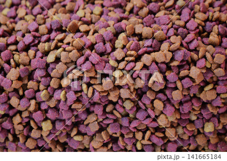 Pet food in various colors stacked in a pile Pet food in various colors stacked in a pile 141665184